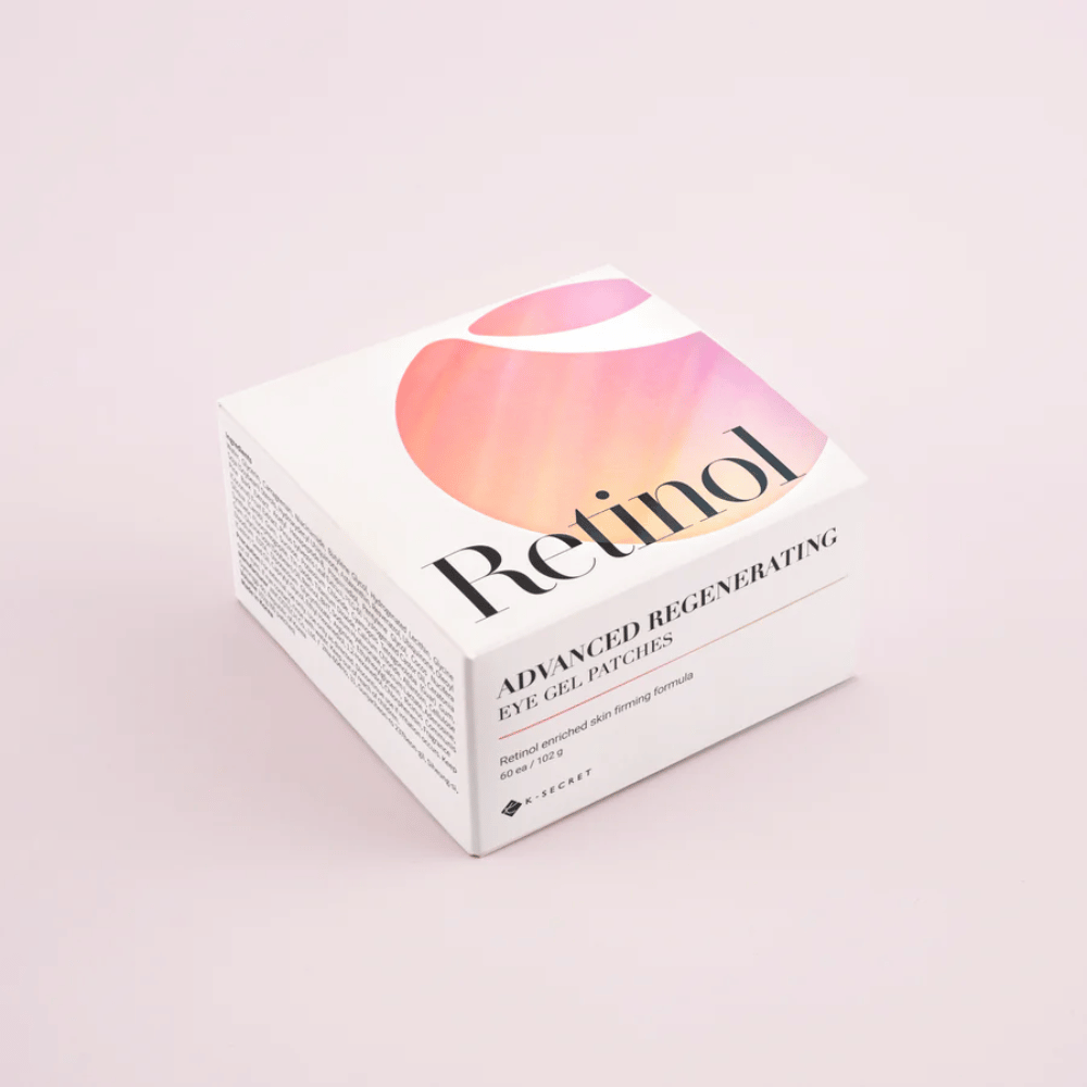 Emballage de K-Secret Patchs Gel pour les Yeux Régénérants Avancés avec rétinol au design blanc et rose.