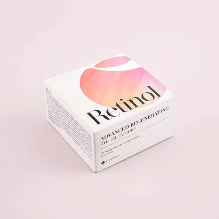 Emballage de K-Secret Patchs Gel pour les Yeux Régénérants Avancés avec rétinol au design blanc et rose.