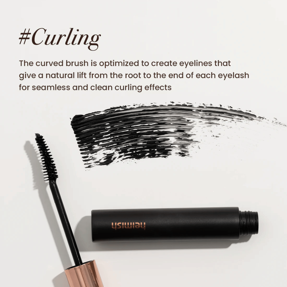 Heimish Dailism Smudge Stop Mascara Recourbant avec une brosse courbée qui soulève et façonne les cils pour un résultat de courbure naturel mais durable.