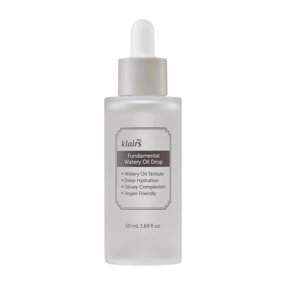Flacon transparent avec pipette contenant Klairs Fundamental Watery Oil Drop, 50 ml. L'étiquette décrit les caractéristiques du produit telles qu'une hydratation profonde, un effet éclatant et une formulation végane.