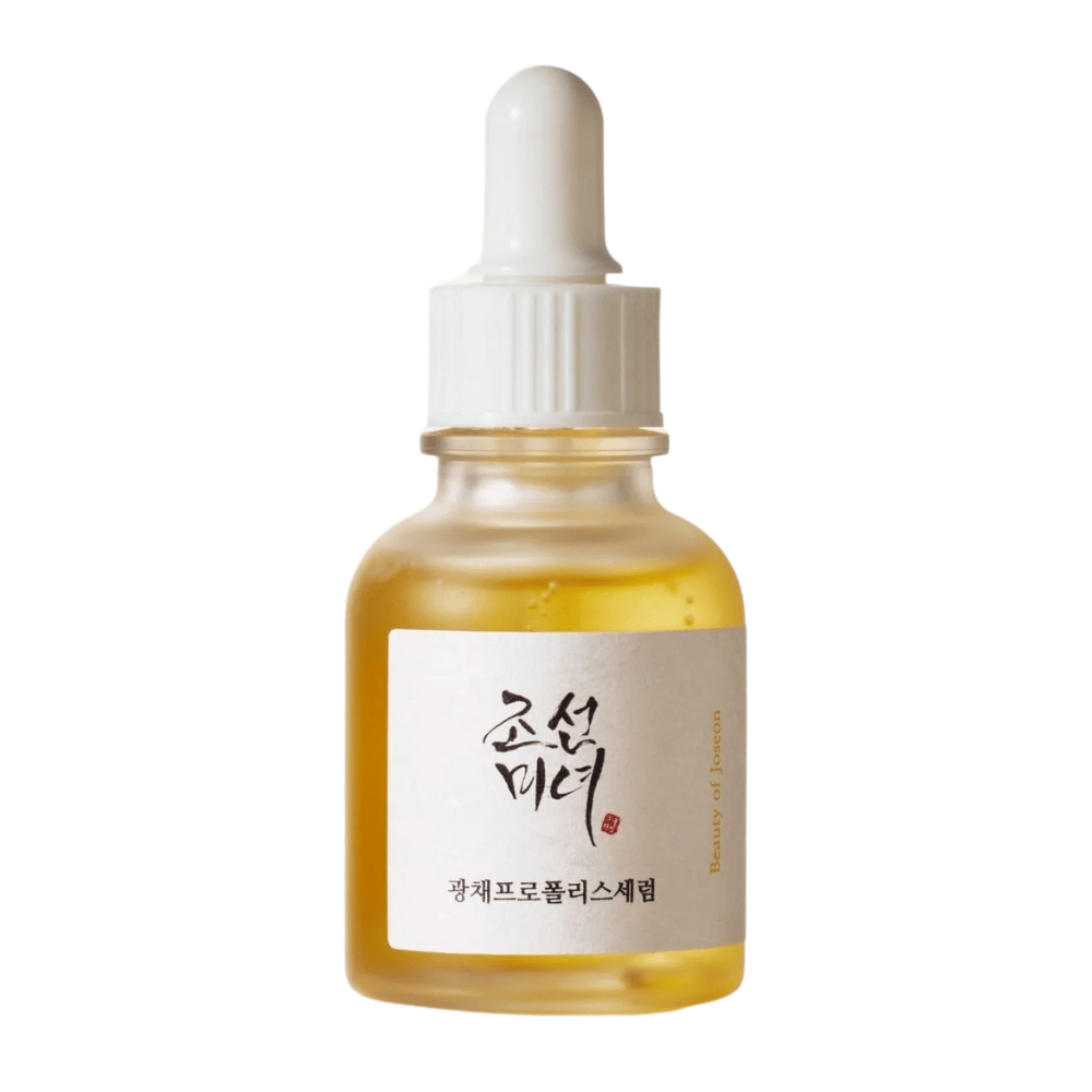 Flacon de Beauty of Joseon Glow Serum avec pipette blanche et sérum doré, un produit illuminant avec propolis et niacinamide.