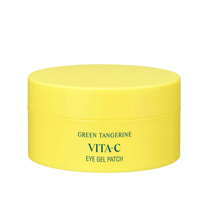 Un pot jaune marqué "GREEN TANGERINE VITA-C EYE GEL PATCH" probablement des masques pour les yeux contenant de la vitamine C.