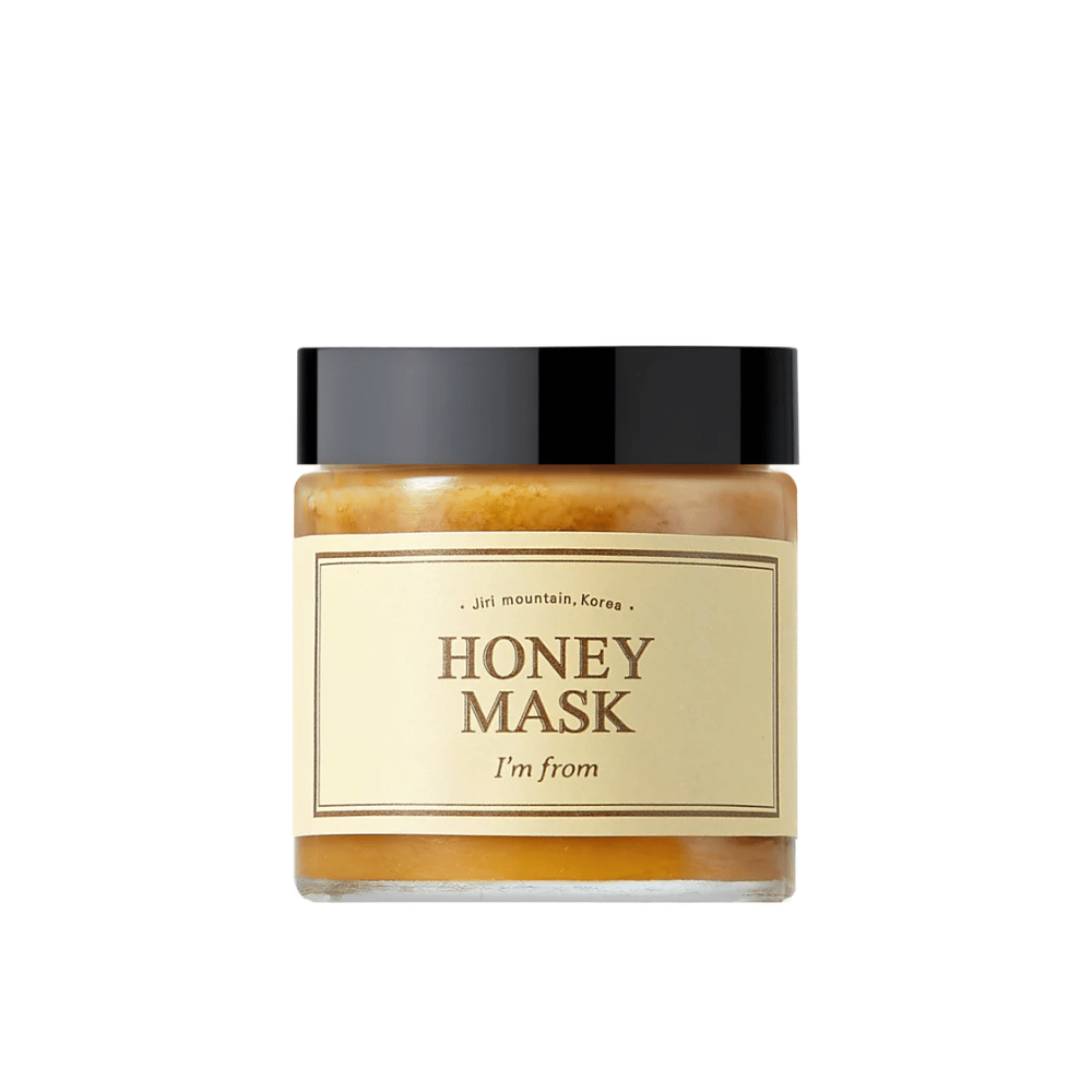  Un pot "I'm from Honey Mask", avec un contenu naturel de miel, sur fond blanc.