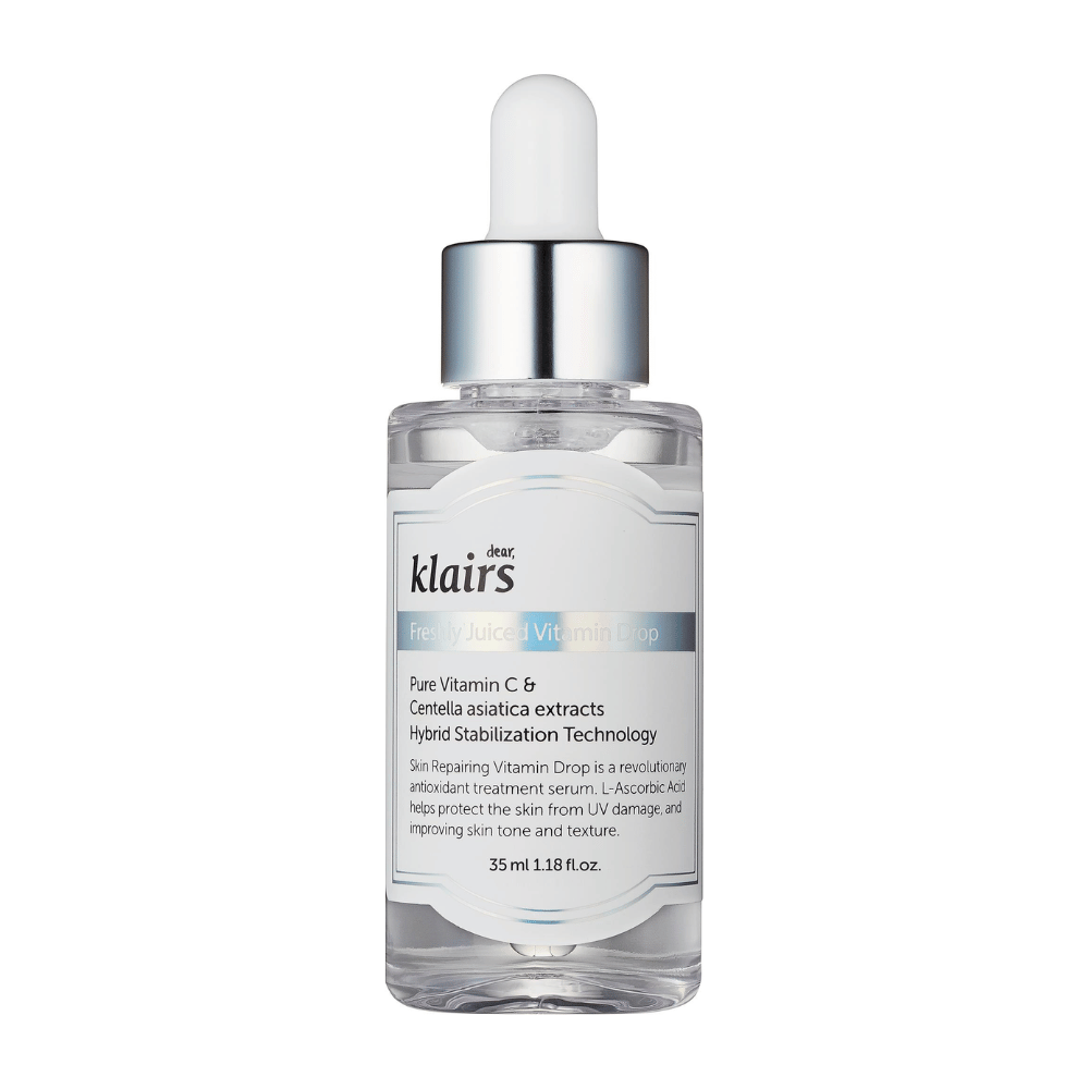 Une bouteille en verre avec un bouchon compte-gouttes de Klairs, Freshly Juiced Vitamin Drop, avec un texte sur la vitamine C et l'extrait de Centella asiatica, sur fond blanc.