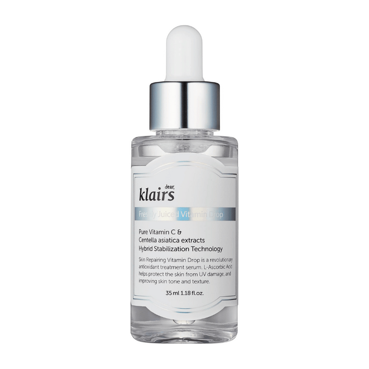 Une bouteille en verre avec un bouchon compte-gouttes de Klairs, Freshly Juiced Vitamin Drop, avec un texte sur la vitamine C et l'extrait de Centella asiatica, sur fond blanc.
