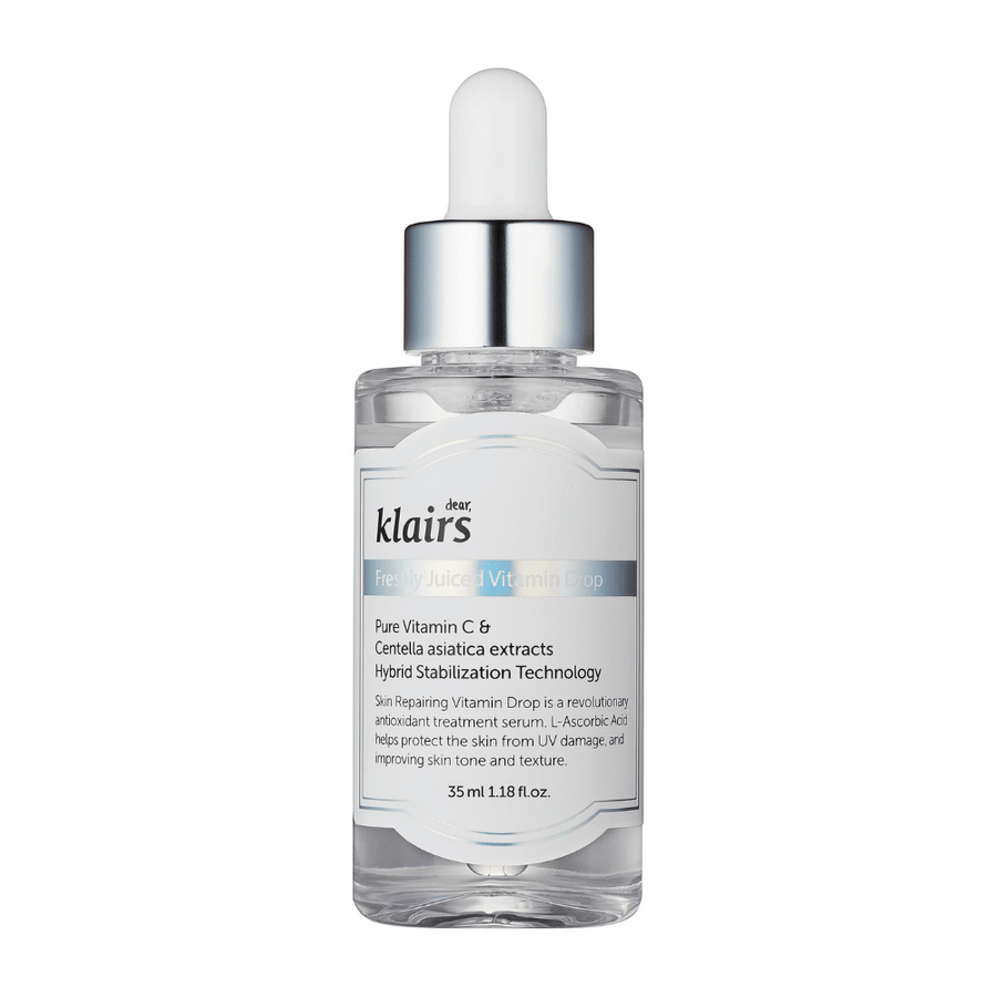 Une bouteille en verre avec un bouchon compte-gouttes de Klairs, Freshly Juiced Vitamin Drop, avec un texte sur la vitamine C et l'extrait de Centella asiatica, sur fond blanc.