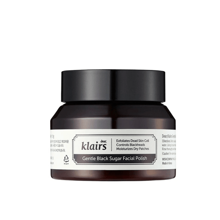 Un pot Klairs Gentle Black Sugar Facial Polish avec un couvercle noir et une étiquette, sur un fond neutre.
