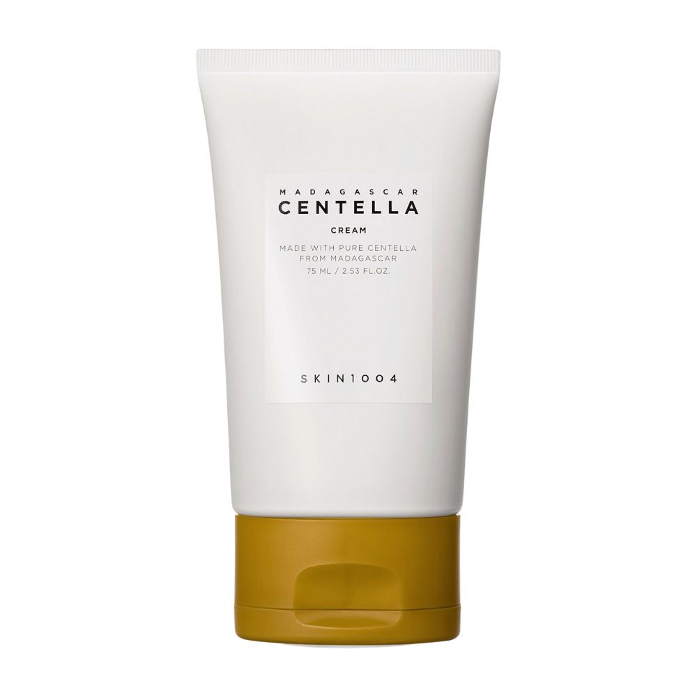 L'image montre un tube de "Madagascar Centella Cream" de SKIN1004. C'est une crème pour la peau fabriquée à partir de Centella pure de Madagascar et elle est disponible dans un emballage de 75 ml / 2,53 fl.oz. Le produit est destiné à être utilisé pour le soin de la peau, pour nourrir et hydrater la peau.