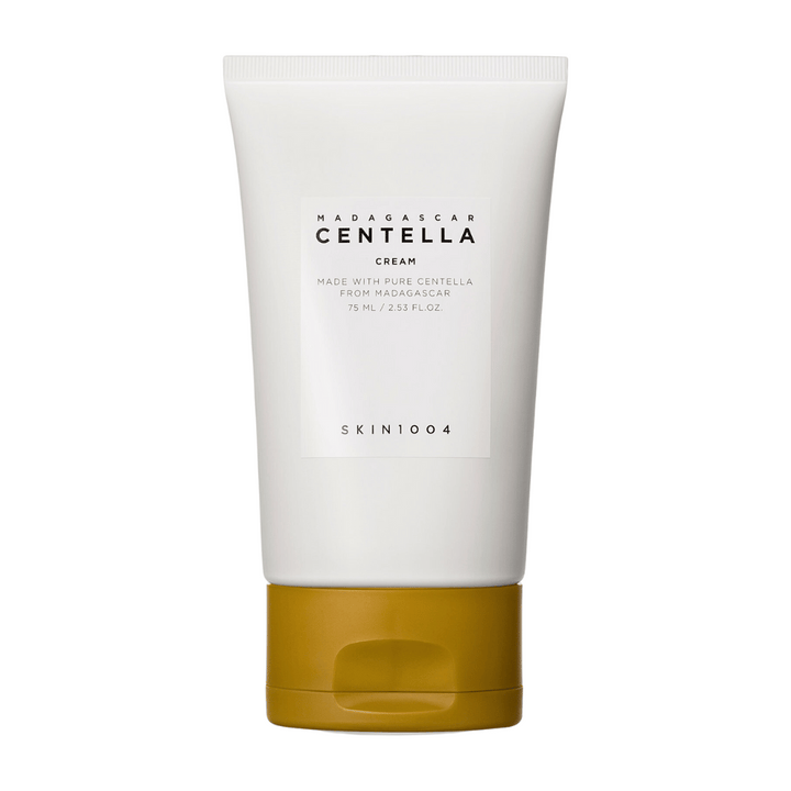 L'image montre un tube de "Madagascar Centella Cream" de SKIN1004. C'est une crème pour la peau fabriquée à partir de Centella pure de Madagascar et elle est disponible dans un emballage de 75 ml / 2,53 fl.oz. Le produit est destiné à être utilisé pour le soin de la peau, pour nourrir et hydrater la peau.