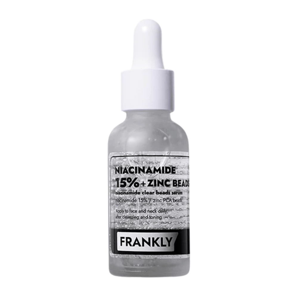 Image du produit FRANKLY Niacinamide 15% + Zinc Beads Serum dans une bouteille en verre avec pipette. Un sérum qui équilibre, apaise et améliore la clarté de la peau.