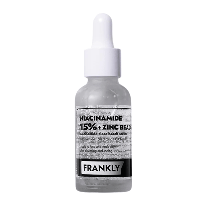 Image du produit FRANKLY Niacinamide 15% + Zinc Beads Serum dans une bouteille en verre avec pipette. Un sérum qui équilibre, apaise et améliore la clarté de la peau.