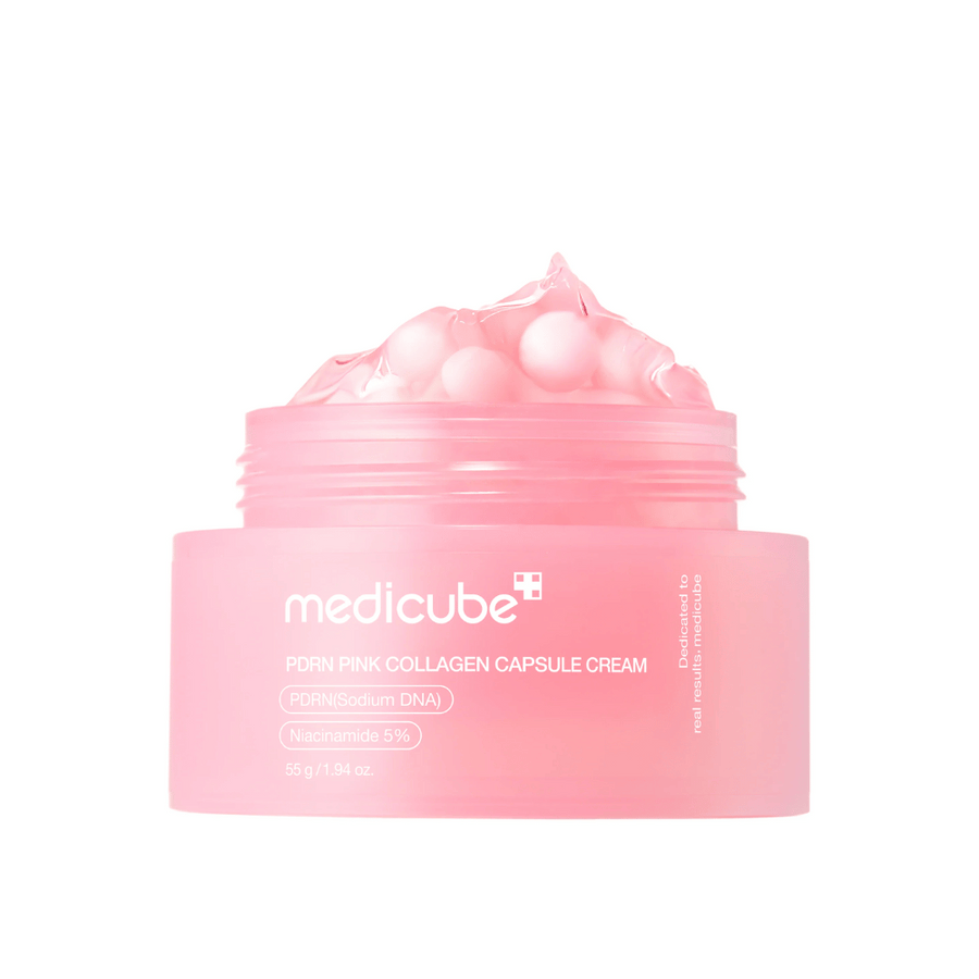 Image du produit de Medicube PDRN Pink Collagen Capsule Cream avec des capsules roses visibles dans un pot rose transparent, conçu pour hydrater et unifier le teint.