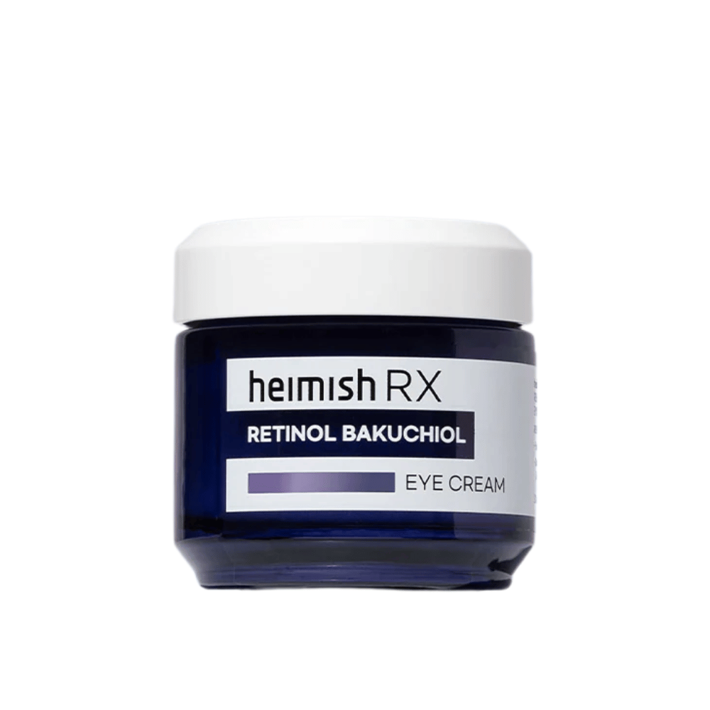 Heimish RX Retinol Bakuchiol Eye Cream dans un pot bleu marine avec un couvercle blanc. Une crème pour les yeux enrichie en rétinol et bakuchiol pour une peau plus lisse et plus ferme autour des yeux.