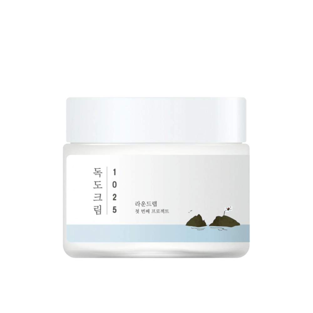 Un pot de Round Lab 1025 Dokdo Cream 80ml pour l'hydratation sur fond blanc.