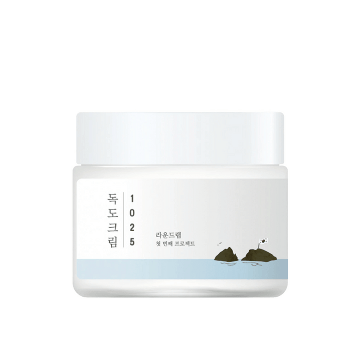 Un pot de Round Lab 1025 Dokdo Cream 80ml pour l'hydratation sur fond blanc.