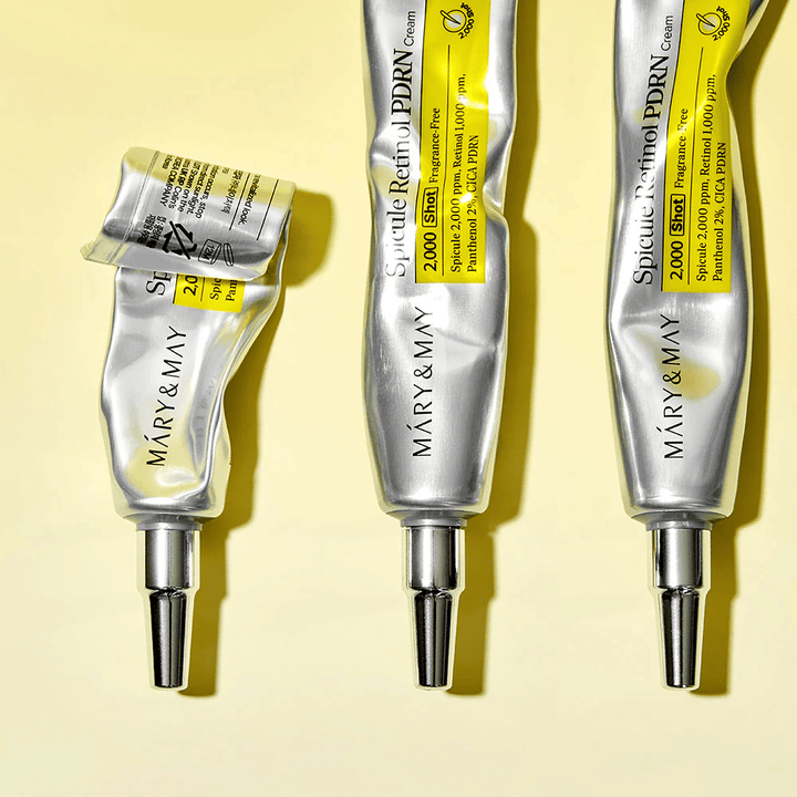 MARY & MAY Spicule Retinol PDRN Cream avec utilisation visible en tube, montre la consistance de la crème et un applicateur ciblé pour une application précise sur la peau.