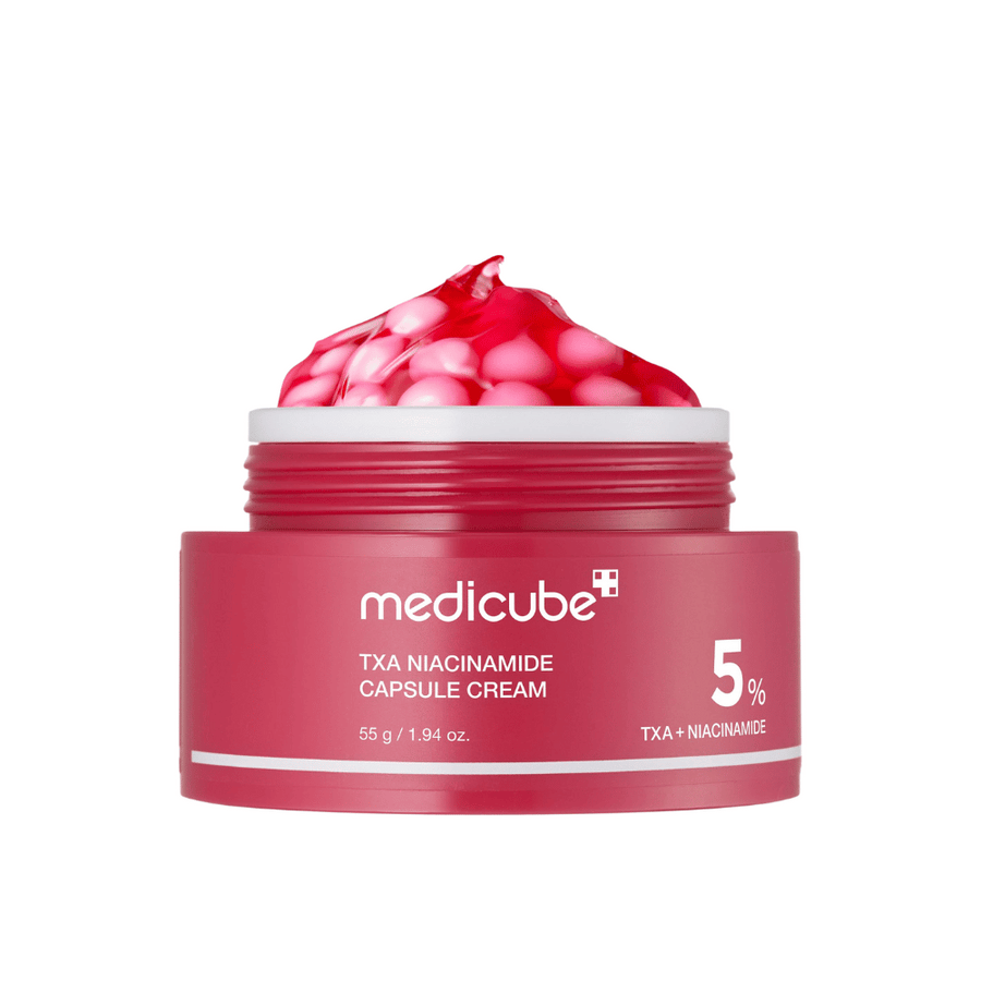 Medicube TXA Niacinamide Capsule Cream en pot de capsules roses en forme de gelée, montrant un marquage de produit clair avec 5 % TXA + Niacinamide.