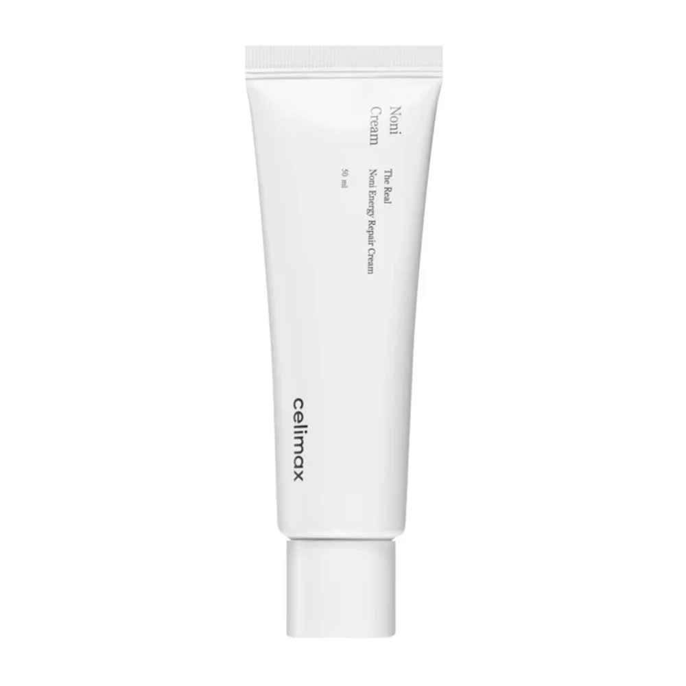 Celimax Noni Energy Repair Cream dans un tube blanc avec du texte noir. Le produit est marqué comme "The Real Noni Energy Repair Cream" et a un volume de 50 ml.