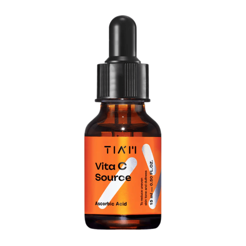 TIA'M Vita C Source, un sérum à l'acide ascorbique dans un flacon en verre brun avec une pipette noire et une étiquette orange – efficace pour éclaircir la peau et réduire les irrégularités du teint.