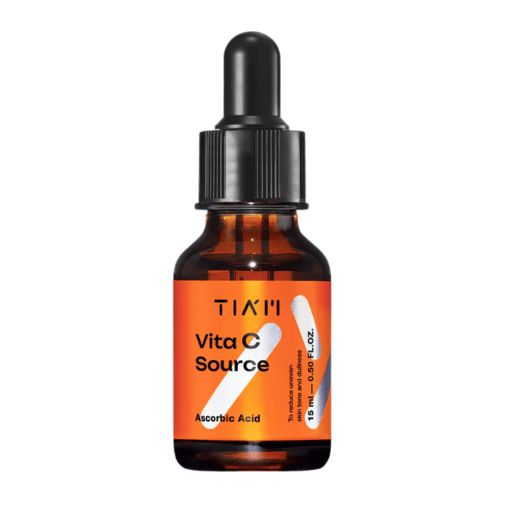 TIA'M Vita C Source, un sérum à l'acide ascorbique dans un flacon en verre brun avec une pipette noire et une étiquette orange – efficace pour éclaircir la peau et réduire les irrégularités du teint.