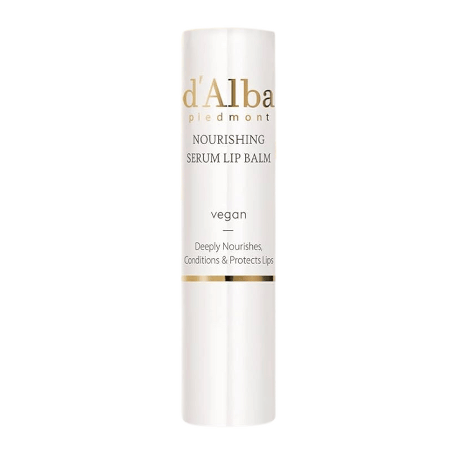 Image du produit sur d'Alba Nourishing Serum Lip Balm en emballage blanc et or avec le texte "vegan" et "Deeply Nourishes, Conditions & Protects Lips".
